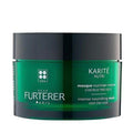 Green hair mask jar with black lid and René Furterer branding on a white background