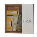 Skincare products in a box with Revuele and Shori branding.