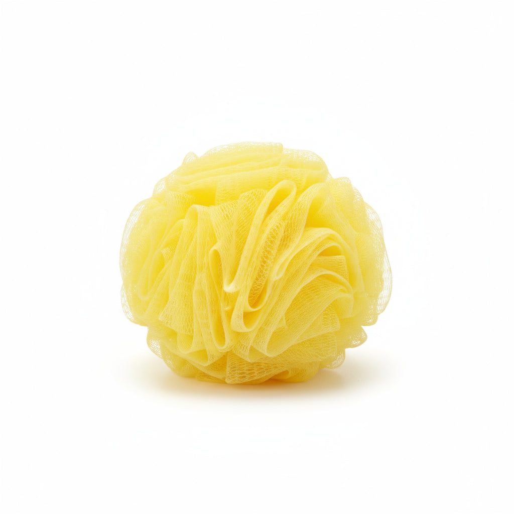 Yellow bath sponge in a teal packaging with 'Sponge by Sea' branding.